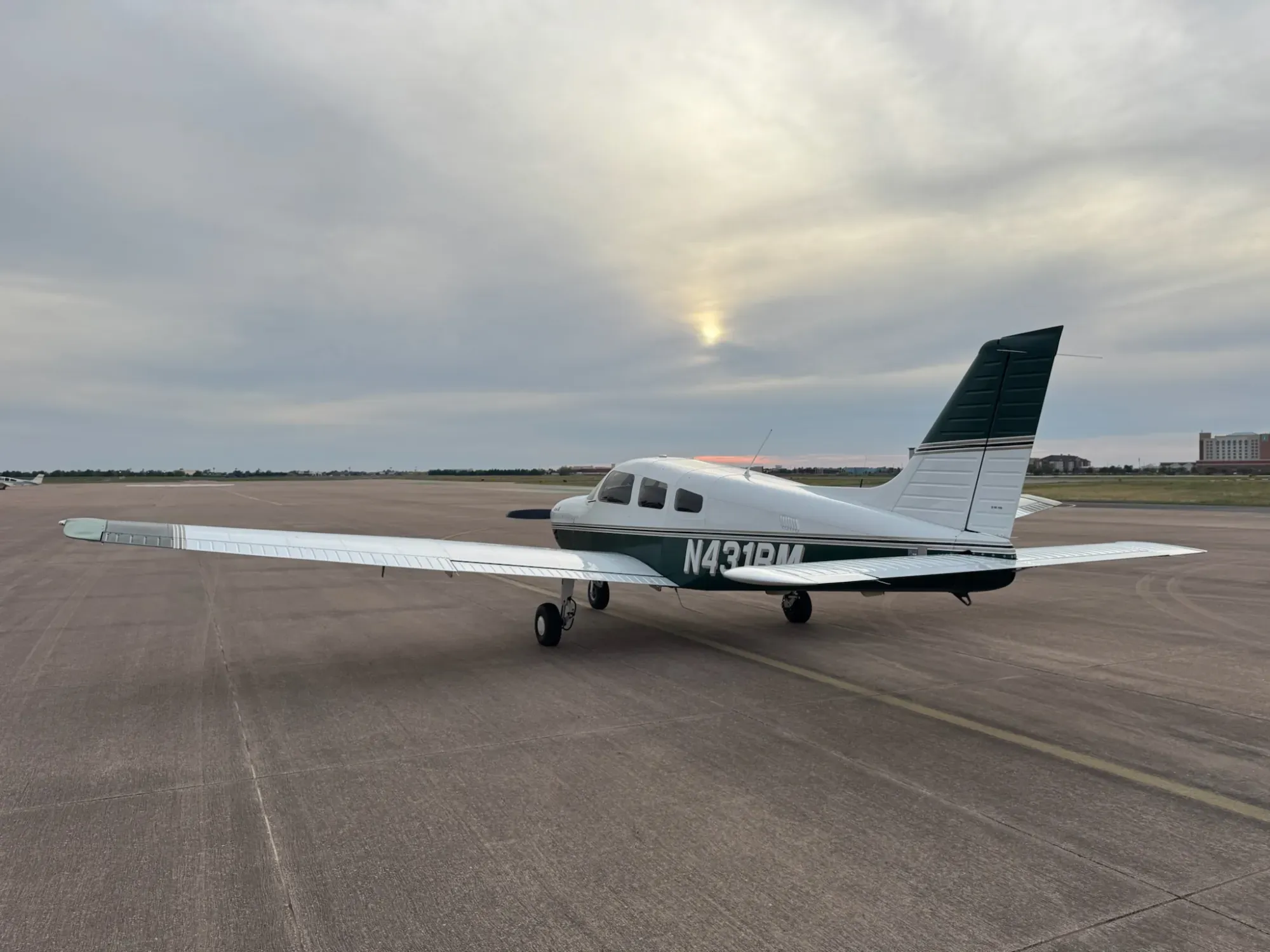 N431RM seen from the left rear quarter under an overcast sky.